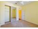 Bright bedroom with mirrored closet doors and carpet at 3401 Home Town Ln, St Cloud, FL 34769