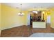 Dining room with tile flooring and chandelier, open to kitchen at 3401 Home Town Ln, St Cloud, FL 34769