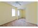Bedroom with mirrored closet doors and ceiling fan at 3401 Home Town Ln, St Cloud, FL 34769