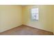 Simple bedroom with window and neutral wall colors at 3401 Home Town Ln, St Cloud, FL 34769