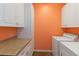 Laundry room with white cabinets and washer and dryer at 3401 Home Town Ln, St Cloud, FL 34769