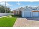 Front view of a light blue and brick home with a garage at 3401 Home Town Ln, St Cloud, FL 34769