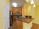 Bright kitchen with stainless steel appliances and light wood cabinets at 3401 Home Town Ln, St Cloud, FL 34769