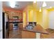 Bright kitchen with stainless steel appliances and light wood cabinets at 3401 Home Town Ln, St Cloud, FL 34769
