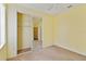 Bright bedroom with mirrored closet and neutral carpeting at 3401 Home Town Ln, St Cloud, FL 34769