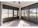 Spacious screened porch with tile flooring and ceiling fan at 3401 Home Town Ln, St Cloud, FL 34769