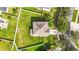 Aerial view showcasing a house's roofline and surrounding landscape at 3804 Marietta Way, St Cloud, FL 34772