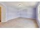 Spacious bedroom with light purple walls and neutral carpeting at 3804 Marietta Way, St Cloud, FL 34772
