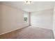 Bright bedroom featuring a large window and neutral carpeting at 3804 Marietta Way, St Cloud, FL 34772