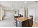 Kitchen with granite island and view of living area at 3804 Marietta Way, St Cloud, FL 34772