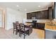 Modern kitchen with granite countertops and dark wood cabinets at 3804 Marietta Way, St Cloud, FL 34772