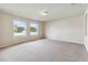 Large living room with neutral carpet and natural light at 3804 Marietta Way, St Cloud, FL 34772