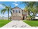 Two-story house with a two-car garage and landscaped lawn at 3804 Marietta Way, St Cloud, FL 34772