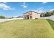Spacious backyard with a large grassy area, providing ample room for recreation at 3804 Marietta Way, St Cloud, FL 34772
