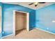 Blue-walled bedroom with ceiling fan and large closet at 3804 Marietta Way, St Cloud, FL 34772