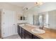 Bathroom boasts double sinks, dark vanity, and a shower with patterned tile at 3804 Marietta Way, St Cloud, FL 34772