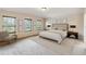 Primary bedroom with plush carpet and large windows at 3804 Marietta Way, St Cloud, FL 34772