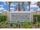 Community entrance sign for Windsor at Westside, with stone and metal detailing at 8912 Sydney Ave, Kissimmee, FL 34747