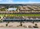 Aerial view showcasing townhouses and a lake at 8912 Sydney Ave, Kissimmee, FL 34747