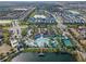 Aerial view showing community amenities including pool, clubhouse, and tennis courts at 8912 Sydney Ave, Kissimmee, FL 34747