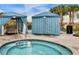 Hot tub with two cabanas and palm trees in the background at 8912 Sydney Ave, Kissimmee, FL 34747