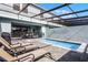 Private pool and patio area with lounge chairs at 8912 Sydney Ave, Kissimmee, FL 34747