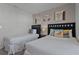 Bedroom with two twin beds, beach themed decor, and window coverings at 8912 Sydney Ave, Kissimmee, FL 34747