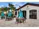 Outdoor bar and lounge area with turquoise umbrellas and seating at 8912 Sydney Ave, Kissimmee, FL 34747