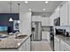 Modern kitchen with stainless steel appliances and granite countertops at 8912 Sydney Ave, Kissimmee, FL 34747