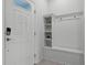 Bright entryway with built-in bench and storage at 8912 Sydney Ave, Kissimmee, FL 34747