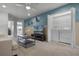 Upstairs bonus room with comfortable seating, TV, and laundry closet at 8912 Sydney Ave, Kissimmee, FL 34747