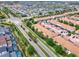 Aerial view showcasing townhouses and neighborhood roads at 8912 Sydney Ave, Kissimmee, FL 34747