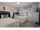 Bedroom with two twin beds, beach themed decor, and window coverings at 8912 Sydney Ave, Kissimmee, FL 34747