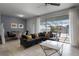 Spacious living room with sectional sofa and view of pool at 8912 Sydney Ave, Kissimmee, FL 34747