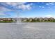 Lakefront view of community with a fountain and several homes at 8912 Sydney Ave, Kissimmee, FL 34747