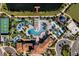 Aerial view of community pool, slides, and courts at 8912 Sydney Ave, Kissimmee, FL 34747