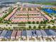 Aerial view of community featuring numerous townhouses and single-Gathering homes at 8912 Sydney Ave, Kissimmee, FL 34747