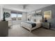 King bedroom with white bed frame, gray walls, and crib at 8912 Sydney Ave, Kissimmee, FL 34747
