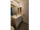 Bathroom with vanity, toilet, and recessed shelving at 1025 S Hiawassee Rd # 2216, Orlando, FL 32835