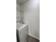 Laundry room with washer, dryer, and shelving at 1025 S Hiawassee Rd # 2216, Orlando, FL 32835