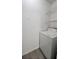 Laundry area with washer, dryer, and shelving units at 1025 S Hiawassee Rd # 2216, Orlando, FL 32835