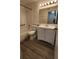 Bathroom with tub, toilet, and vanity with light at 1025 S Hiawassee Rd # 2216, Orlando, FL 32835