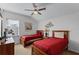 Bedroom with twin beds, ceiling fan and neutral decor at 131 Cadiz Loop, Davenport, FL 33837