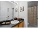 Clean bathroom with a single sink vanity and shower/tub combo at 131 Cadiz Loop, Davenport, FL 33837