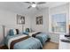 Bright bedroom with twin beds and neutral decor at 131 Cadiz Loop, Davenport, FL 33837