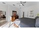 Bedroom with king-size bed, dresser and access to living room at 131 Cadiz Loop, Davenport, FL 33837