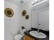Small half bathroom with single sink and toilet at 131 Cadiz Loop, Davenport, FL 33837
