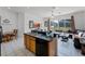 Open kitchen with an island, stainless steel appliances, and adjacent to Gathering room at 131 Cadiz Loop, Davenport, FL 33837