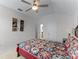 Comfortable bedroom with a queen-size bed and access to a bathroom at 131 Cadiz Loop, Davenport, FL 33837