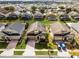 Aerial view of neighborhood with houses and yards at 131 Cadiz Loop, Davenport, FL 33837